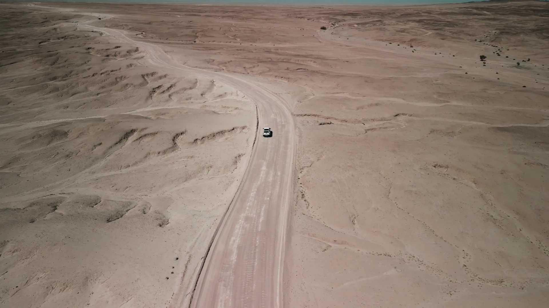 Aerial view of a gravel road through the Namibian desert